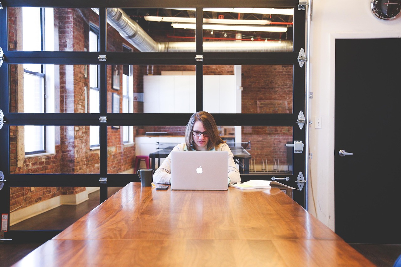 Woman working diligently at a computer