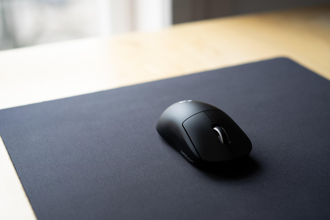 A high-performance gaming mouse on a mouse pad, highlighting precision and competitive gaming.