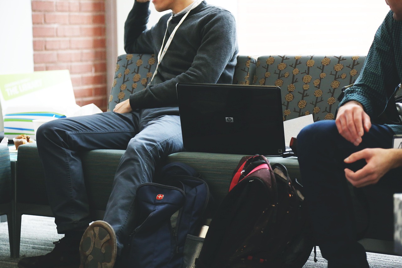 Team collaborating on laptops in a modern office