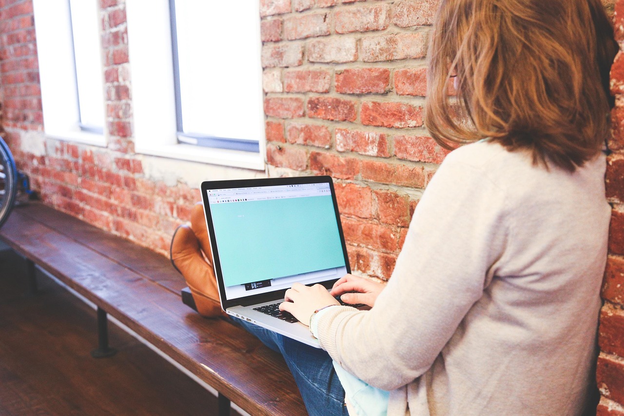 Woman typing on keyboard